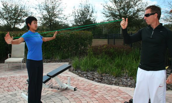 Cindy and Trainer Dave Herman work on her Flexibility with the New S5 Bands.